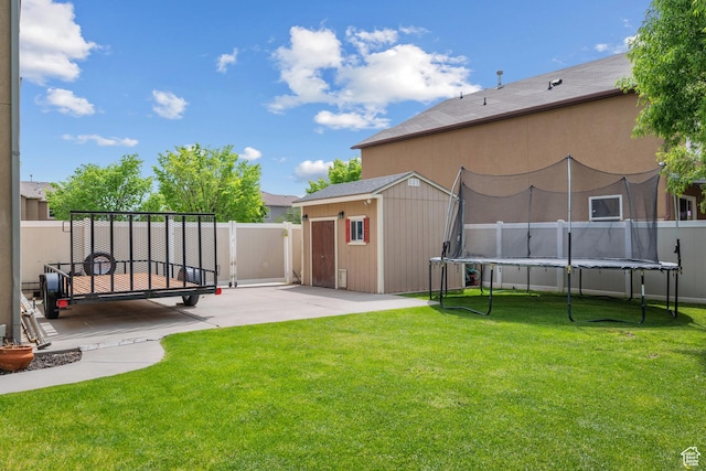 1066 W 1325 S, Springville, UT 84663 - view of yard featuring a trampoline, a patio, a storage unit, and an outbuilding