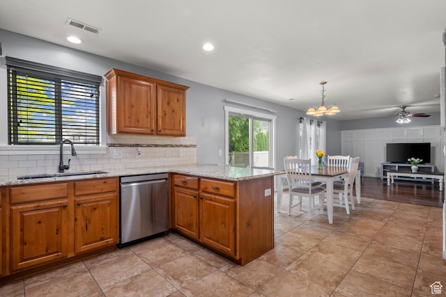 1066 W 1325 S, Springville, UT 84663 - kitchen with dishwasher, a sink, a peninsula, decorative backsplash, and brown cabinetry