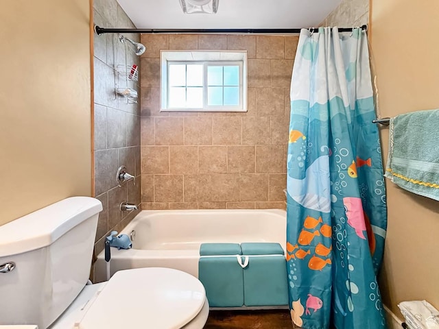 full bathroom with shower / tub combo with curtain and toilet