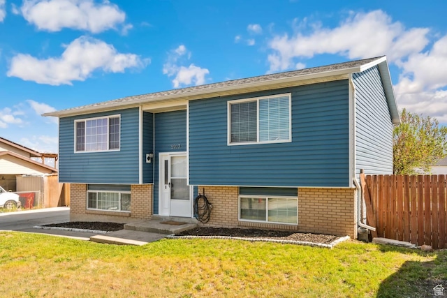 split foyer home with brick siding