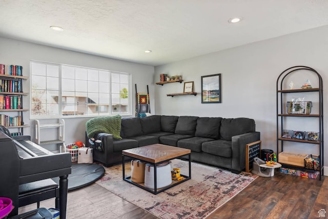 living room with wood finished floors and recessed lighting