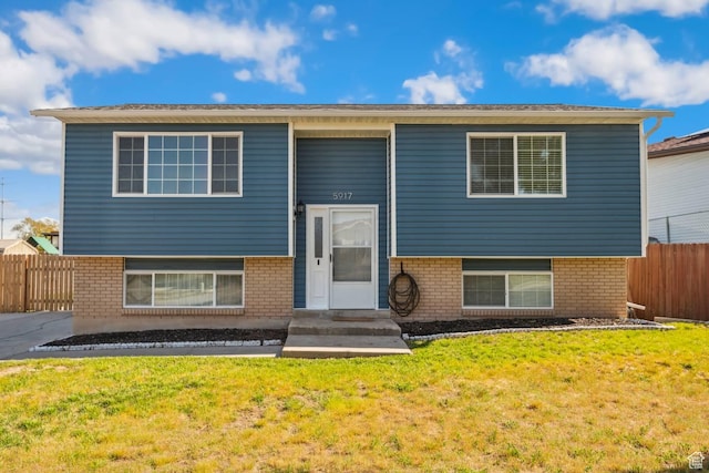 split foyer home with brick siding