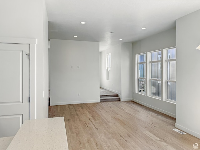8268 Joshua Tree Ln W, Magna, UT 84044 - empty room with recessed lighting, baseboards, and light wood finished floors