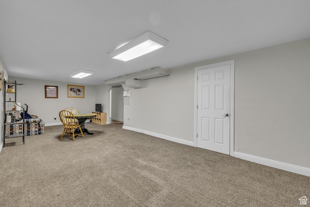 finished basement featuring carpet floors and baseboards