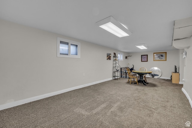 playroom featuring carpet floors and baseboards