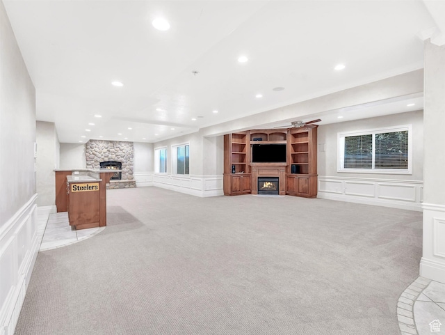 10868 S Prescott Dr E, Sandy, UT 84092 - unfurnished living room with a fireplace, a decorative wall, light carpet, recessed lighting, and wainscoting