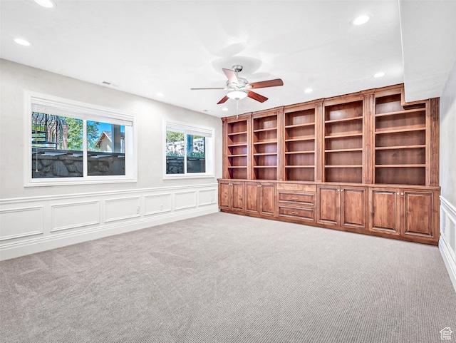 10868 S Prescott Dr E, Sandy, UT 84092 - unfurnished living room featuring recessed lighting, carpet, a ceiling fan, and a decorative wall
