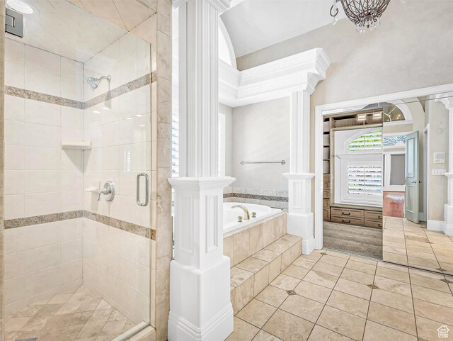 10868 S Prescott Dr E, Sandy, UT 84092 - full bathroom with a stall shower, tile patterned flooring, a bath, and ornate columns