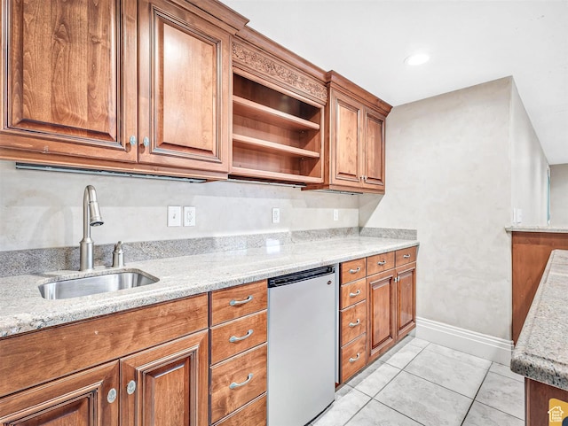 10868 S Prescott Dr E, Sandy, UT 84092 - kitchen featuring refrigerator, a sink, brown cabinets, and light stone countertops