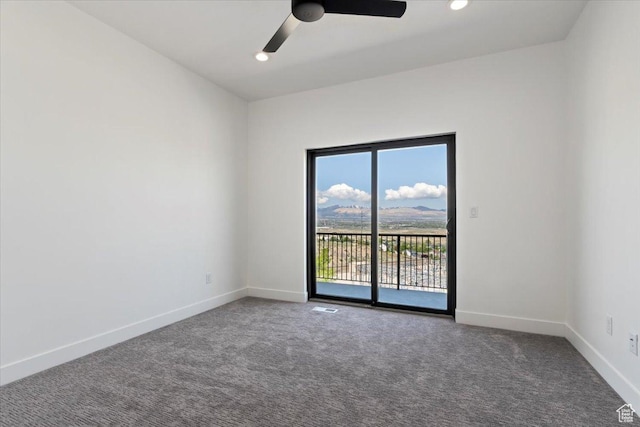 carpeted spare room featuring a ceiling fan, baseboards, and recessed lighting