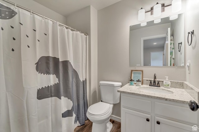 full bathroom with wood finished floors, toilet, vanity, baseboards, and a shower with shower curtain