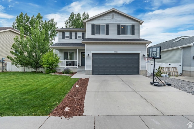 traditional home with a porch, an attached garage, and concrete driveway