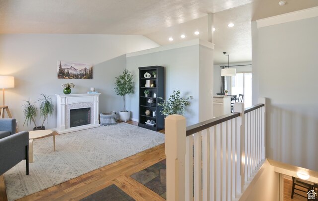 4931 W Berry Creek Dr, Riverton, UT 84096 - living room with a premium fireplace, vaulted ceiling, wood finished floors, and recessed lighting