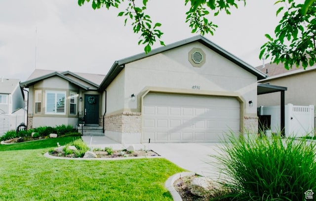 4931 W Berry Creek Dr, Riverton, UT 84096 - ranch-style house featuring an attached garage, brick siding, stucco siding, and concrete driveway