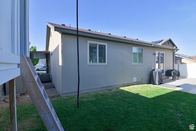 4931 W Berry Creek Dr, Riverton, UT 84096 - rear view of house featuring central AC unit, stucco siding, and a patio area