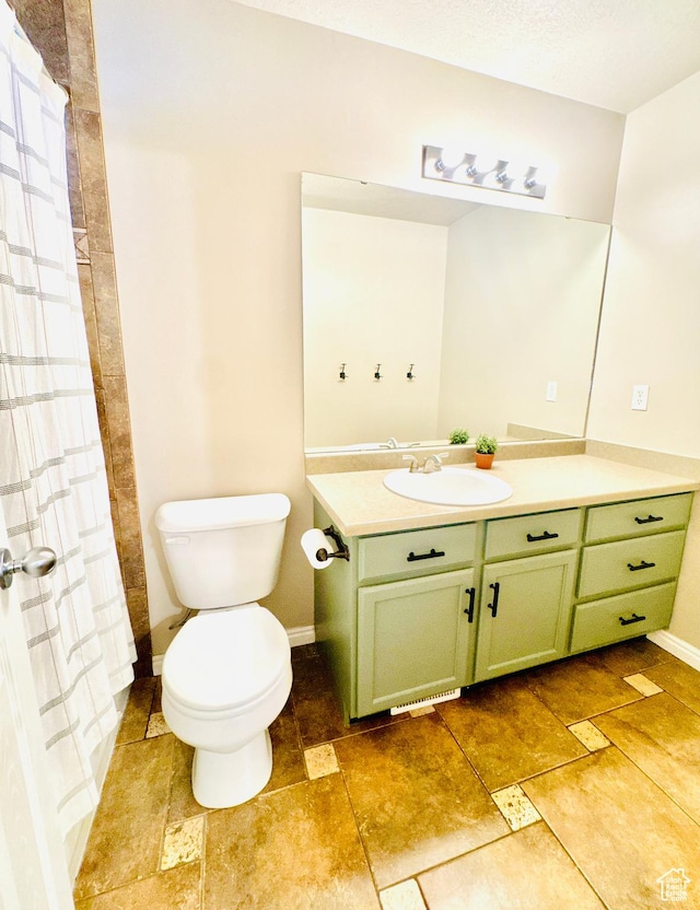 4931 W Berry Creek Dr, Riverton, UT 84096 - full bath with vanity, toilet, curtained shower, and baseboards