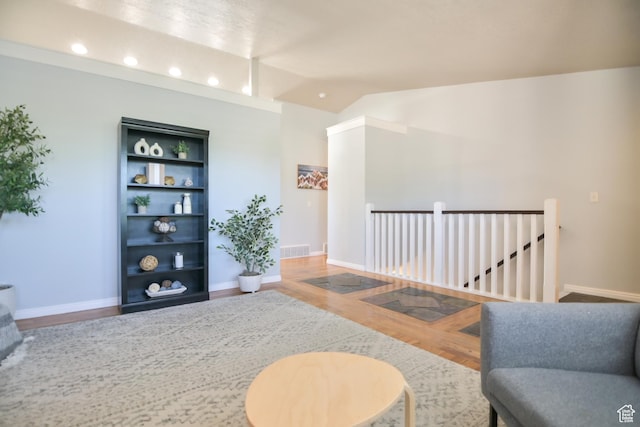 4931 W Berry Creek Dr, Riverton, UT 84096 - living area with wood finished floors, lofted ceiling, recessed lighting, baseboards, and built in features