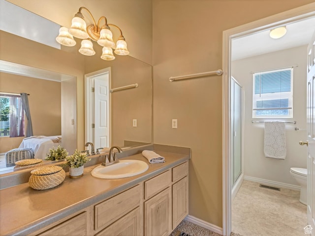 full bath featuring toilet, vanity, a shower stall, ensuite bath, and baseboards