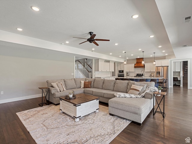 4591 N Abbey Way, Eden, UT 84310 - living area featuring dark wood-style flooring, ceiling fan, baseboards, recessed lighting, and stairway