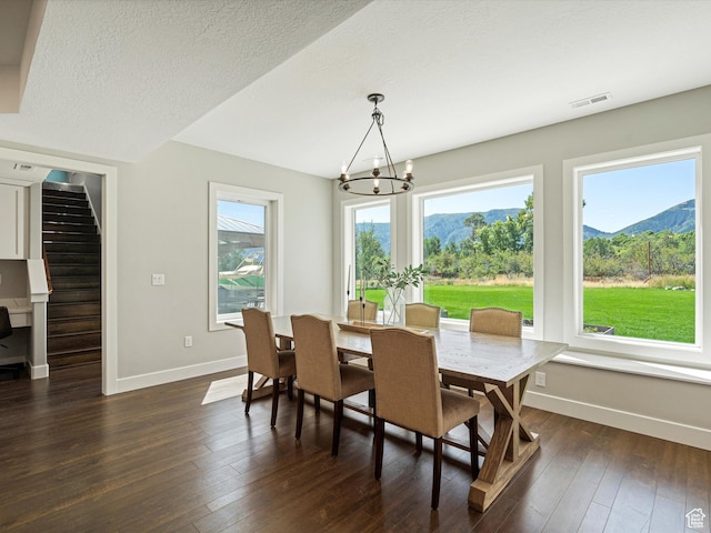 4591 N Abbey Way, Eden, UT 84310 - dining area with baseboards, a chandelier, dark wood-style floors, stairway, and a mountain view