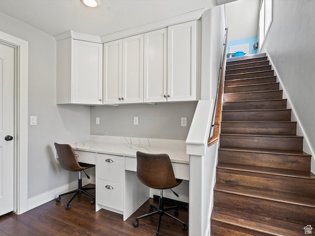 4591 N Abbey Way, Eden, UT 84310 - home office featuring built in desk, baseboards, and dark wood-style floors