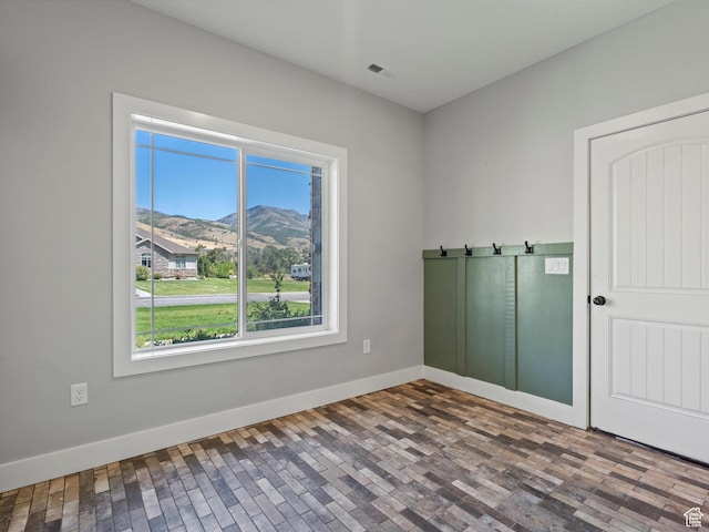 4591 N Abbey Way, Eden, UT 84310 - unfurnished room featuring a mountain view and baseboards