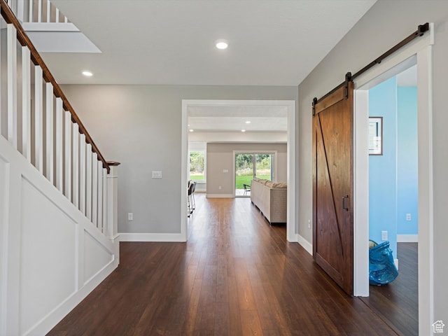 4591 N Abbey Way, Eden, UT 84310 - entryway featuring a barn door, dark wood-style floors, stairs, baseboards, and recessed lighting