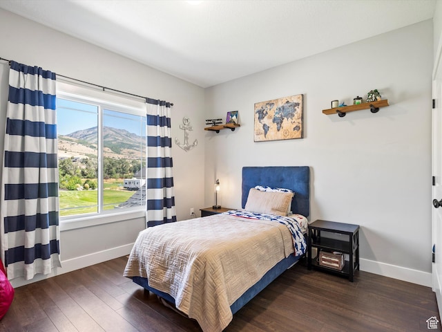4591 N Abbey Way, Eden, UT 84310 - bedroom featuring baseboards, hardwood / wood-style floors, and a mountain view