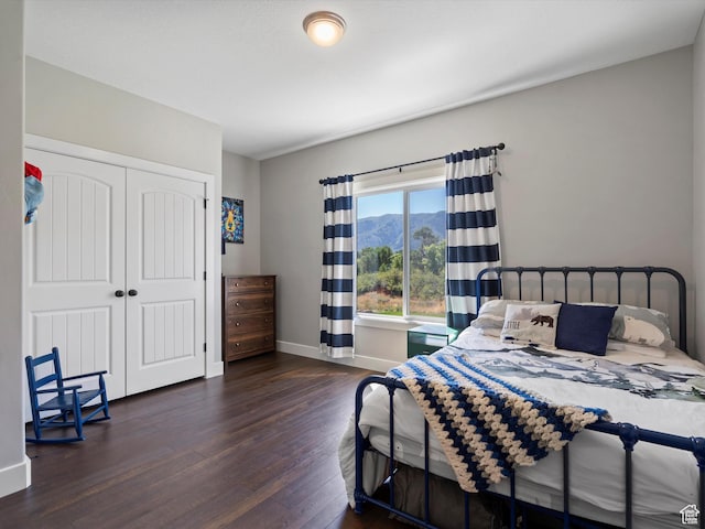 4591 N Abbey Way, Eden, UT 84310 - bedroom featuring wood finished floors, baseboards, and a closet