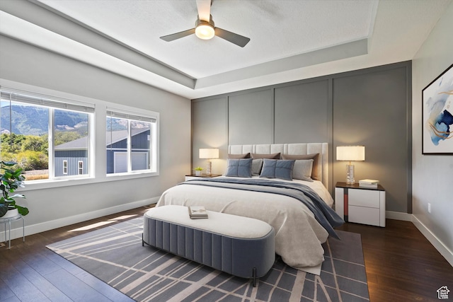 4591 N Abbey Way, Eden, UT 84310 - bedroom with a raised ceiling, wood-type flooring, and baseboards