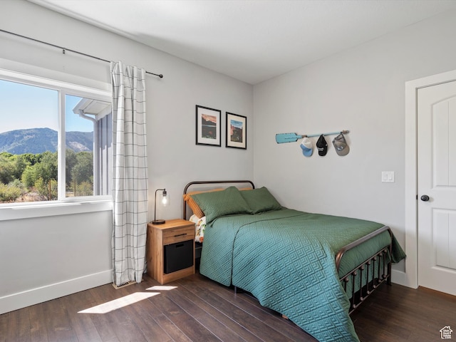 4591 N Abbey Way, Eden, UT 84310 - bedroom with wood finished floors, a mountain view, and baseboards
