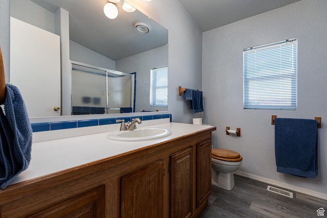 1074 Altus Ln, Fredonia, AZ 86022 - full bath with a stall shower, wood finished floors, vanity, toilet, and baseboards