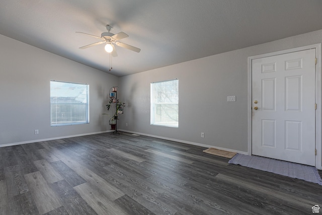 1074 Altus Ln, Fredonia, AZ 86022 - unfurnished room featuring ceiling fan, dark wood-style flooring, baseboards, and vaulted ceiling