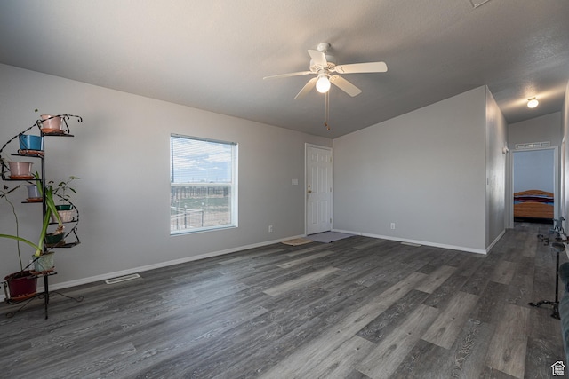 1074 Altus Ln, Fredonia, AZ 86022 - unfurnished living room featuring ceiling fan, dark wood-type flooring, and baseboards