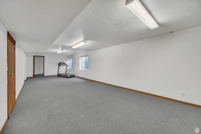 3270 E Danish Hills Cir, Salt Lake City, UT 84121 - basement featuring baseboards, carpet floors, and a textured ceiling