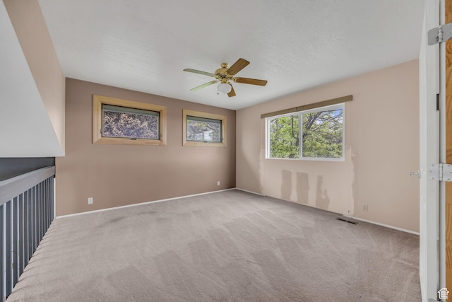 3270 E Danish Hills Cir, Salt Lake City, UT 84121 - carpeted spare room featuring a ceiling fan and baseboards