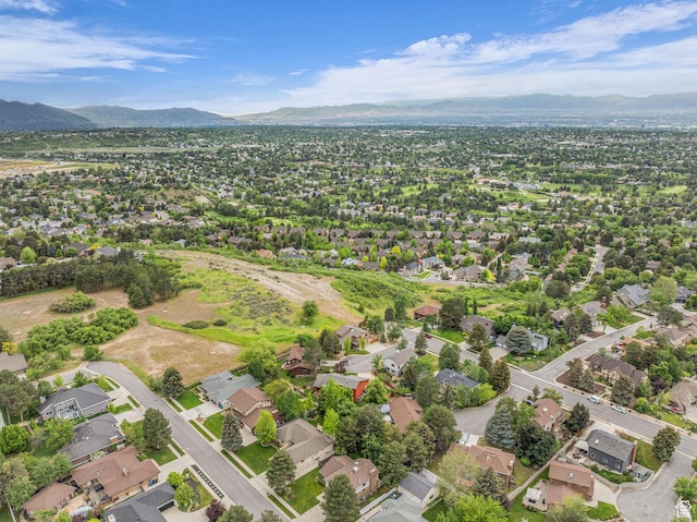 3270 E Danish Hills Cir, Salt Lake City, UT 84121 - aerial view of property's location with a mountainous background and nearby suburban area