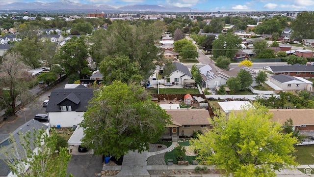 aerial overview of property's location with nearby suburban area and a mountain backdrop