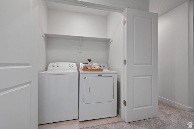 washroom with washer and clothes dryer