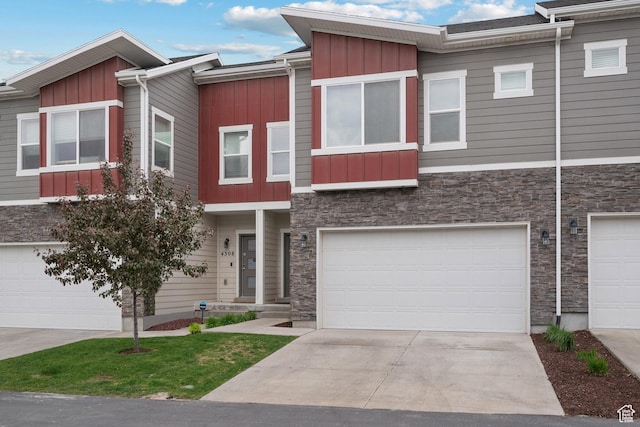 multi unit property with board and batten siding and stone siding