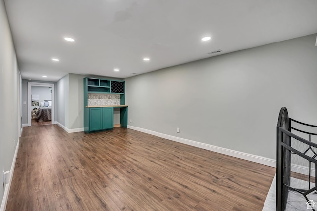 476 E 3050 N, North Ogden, UT 84414 - unfurnished living room featuring dark wood-style floors, baseboards, and recessed lighting