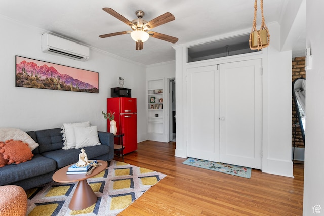 86 N B St Unit 34, Salt Lake City, UT 84150 - living area featuring a wall mounted air conditioner, wood finished floors, ornamental molding, ceiling fan, and built in features