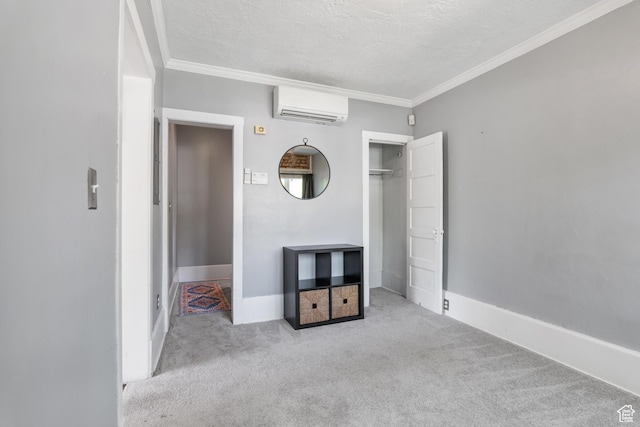 86 N B St Unit 34, Salt Lake City, UT 84150 - unfurnished bedroom featuring an AC wall unit, carpet flooring, a textured ceiling, crown molding, and baseboards