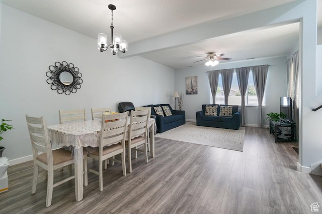 dining room with wood finished floors, baseboards, a chandelier, beam ceiling, and ceiling fan