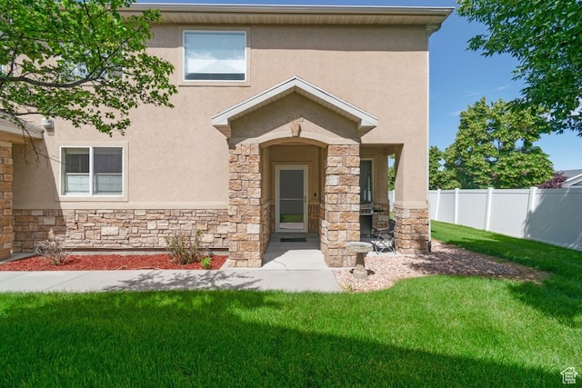 view of front of home with stone siding and stucco siding