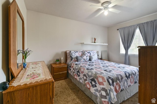 carpeted bedroom featuring a ceiling fan