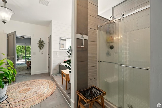 538 W 600 S, Logan, UT 84321 - bathroom with a shower stall, tile patterned flooring, and a ceiling fan