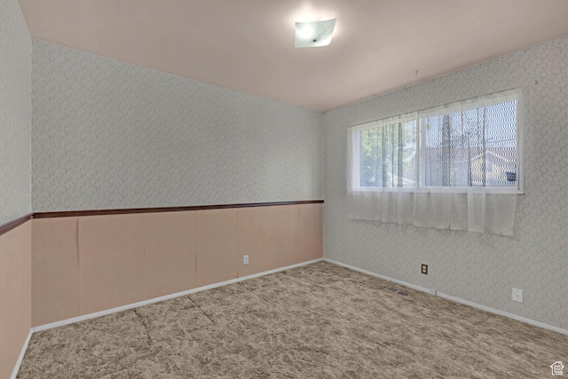 3927 W Rawhide Dr S, West Valley City, UT 84120 - carpeted spare room featuring wallpapered walls