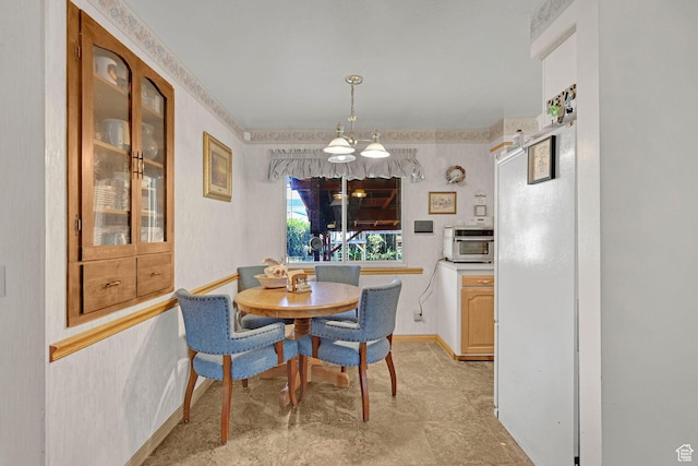 3927 W Rawhide Dr S, West Valley City, UT 84120 - dining space featuring baseboards and a chandelier
