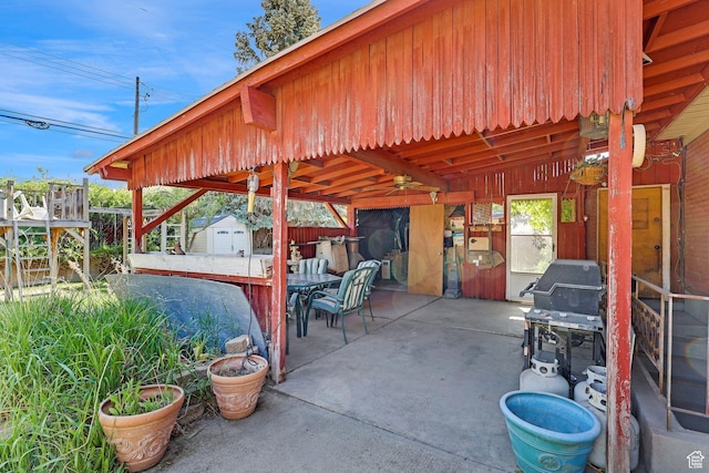 3927 W Rawhide Dr S, West Valley City, UT 84120 - view of patio / terrace with a storage shed, an outdoor structure, outdoor dining space, fence, and grilling area